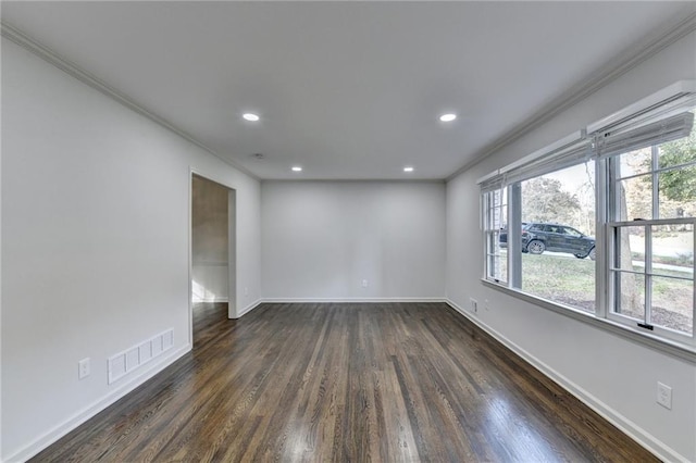 unfurnished room with crown molding and dark wood-type flooring