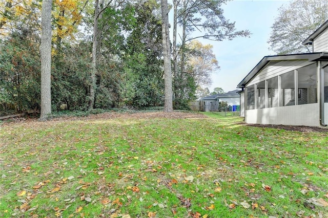 view of yard with a sunroom