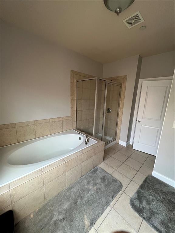 bathroom with independent shower and bath and tile patterned floors