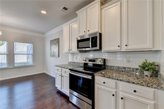 kitchen with hanging light fixtures, dishwasher, white cabinets, and an island with sink