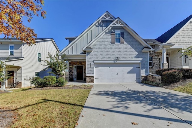 craftsman inspired home featuring a garage and a front yard