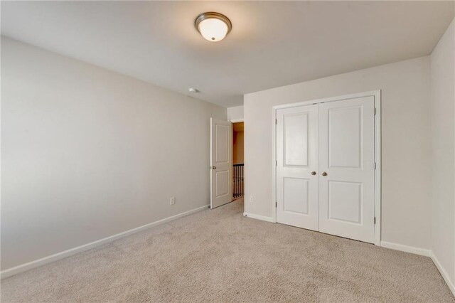 washroom featuring washing machine and dryer and light tile patterned flooring