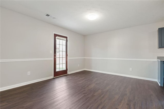139 Palmetto St, Locust Grove, GA 30248 - empty room with dark wood-style flooring and baseboards