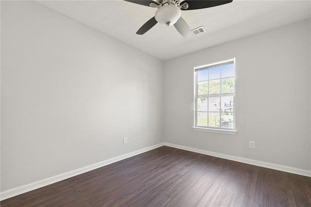 139 Palmetto St, Locust Grove, GA 30248 - unfurnished room featuring dark wood-style floors, baseboards, and a ceiling fan