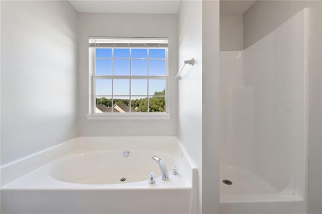 139 Palmetto St, Locust Grove, GA 30248 - bathroom featuring a bath and a shower
