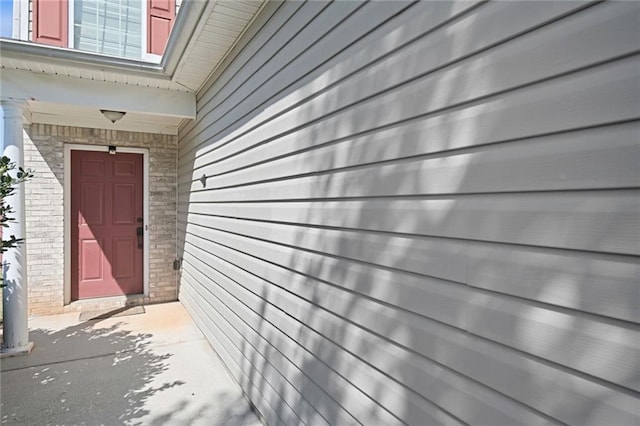 139 Palmetto St, Locust Grove, GA 30248 - view of exterior entry featuring brick siding
