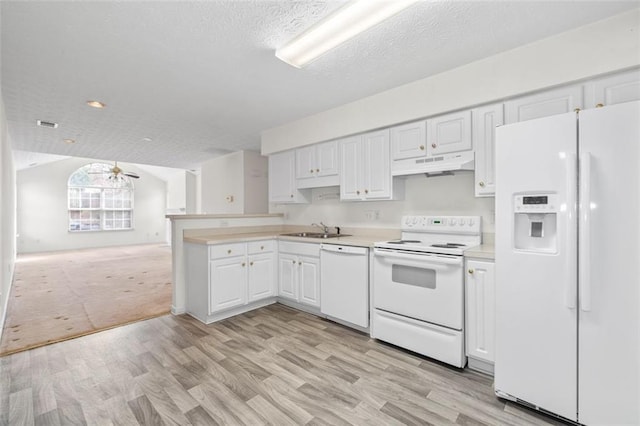 kitchen with under cabinet range hood, white appliances, white cabinetry, open floor plan, and light countertops