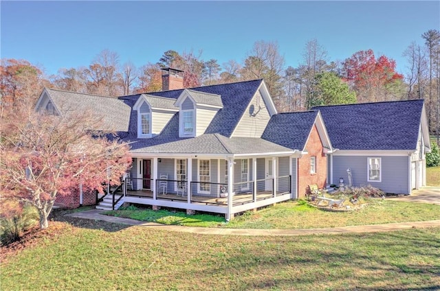 rear view of property with a lawn, a chimney, a porch, and a shingled roof