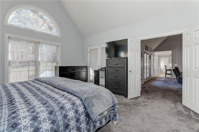 bedroom featuring carpet flooring, french doors, and high vaulted ceiling