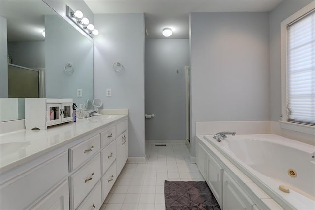 full bathroom featuring tile patterned flooring, a stall shower, a tub with jets, double vanity, and plenty of natural light