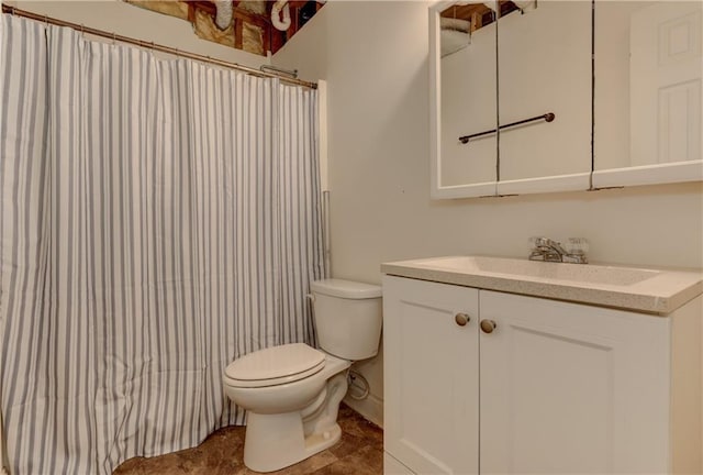 full bathroom with toilet, vanity, and curtained shower