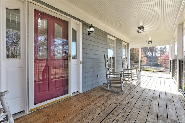 deck featuring covered porch