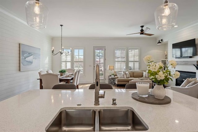 12603 Itaska Walk, Milton, GA 30004 - kitchen with a sink, open floor plan, ceiling fan, a chandelier, and pendant lighting