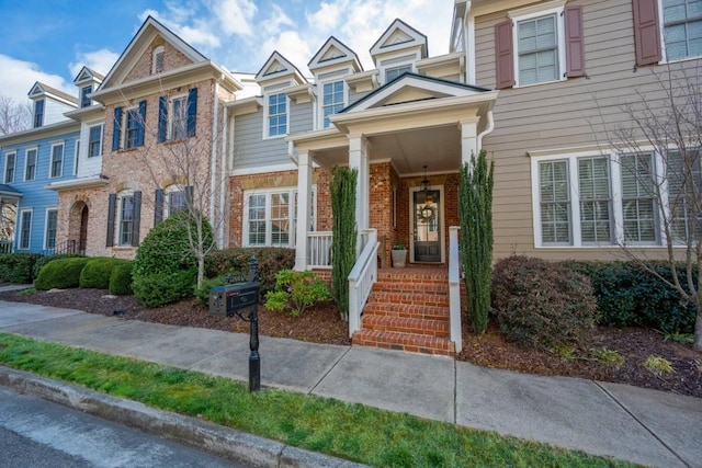 12603 Itaska Walk, Milton, GA 30004 - townhome / multi-family property featuring brick siding and a porch