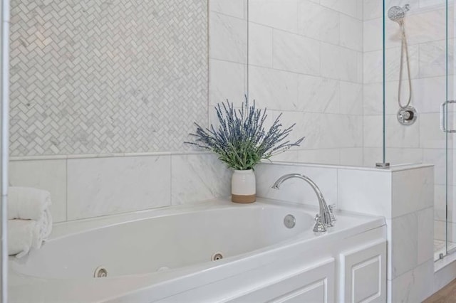 12603 Itaska Walk, Milton, GA 30004 - bathroom featuring a shower stall and a tub with jets