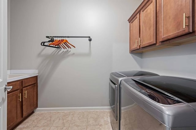 12603 Itaska Walk, Milton, GA 30004 - washroom with cabinet space, independent washer and dryer, and baseboards