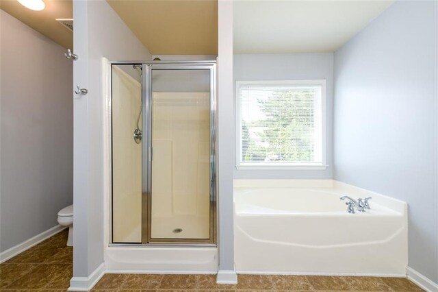 bathroom with separate shower and tub, tile patterned flooring, and toilet