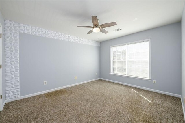 carpeted empty room with ceiling fan