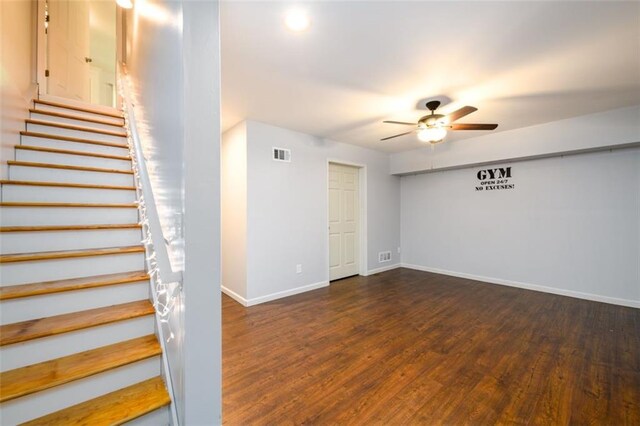 interior space with ceiling fan and dark hardwood / wood-style floors