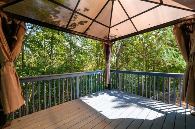 wooden deck with a gazebo