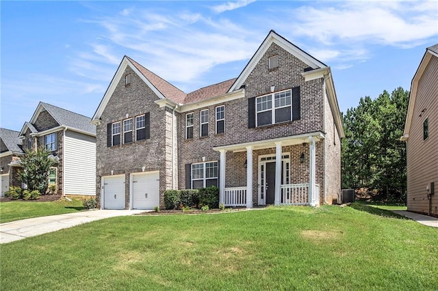 view of front of home featuring cooling unit, a porch, a garage, and a front yard