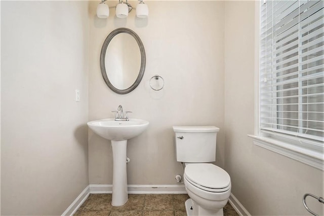157 Spur Ln, Hiram, GA 30141 - half bath with toilet, baseboards, a sink, and tile patterned floors