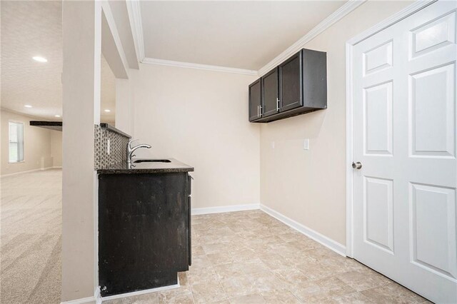 157 Spur Ln, Hiram, GA 30141 - laundry area featuring a sink, crown molding, baseboards, and recessed lighting