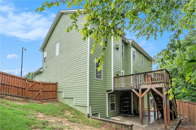 157 Spur Ln, Hiram, GA 30141 - back of property with a deck, a fenced backyard, a patio area, and stairs