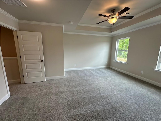 empty room featuring baseboards, carpet, and visible vents