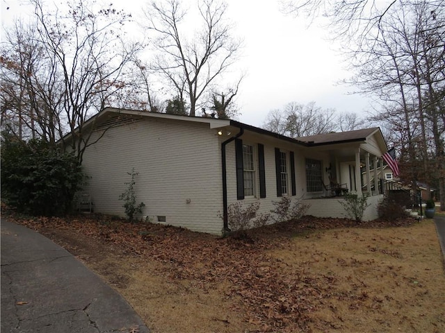 view of home's exterior with covered porch