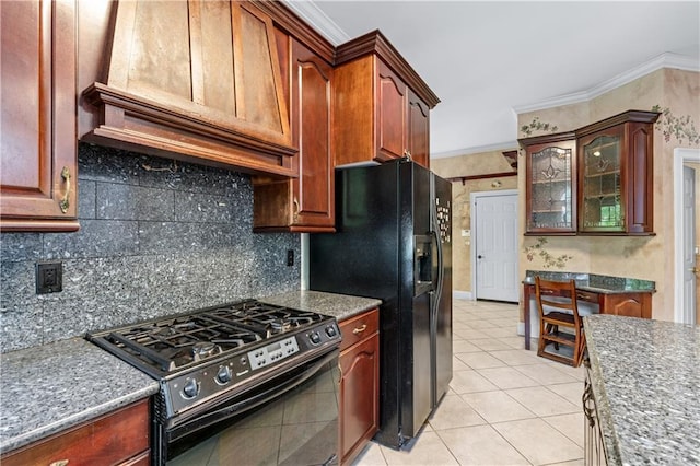 11569 Finley St, Suwanee, GA 30024 - kitchen featuring black appliances, custom range hood, decorative backsplash, ornamental molding, and glass insert cabinets