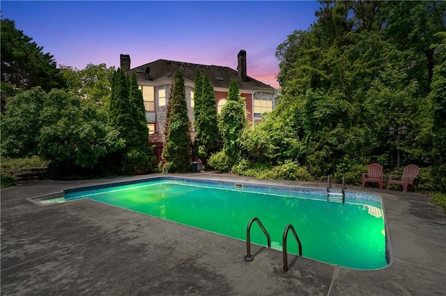 11569 Finley St, Suwanee, GA 30024 - pool at dusk with an outdoor pool