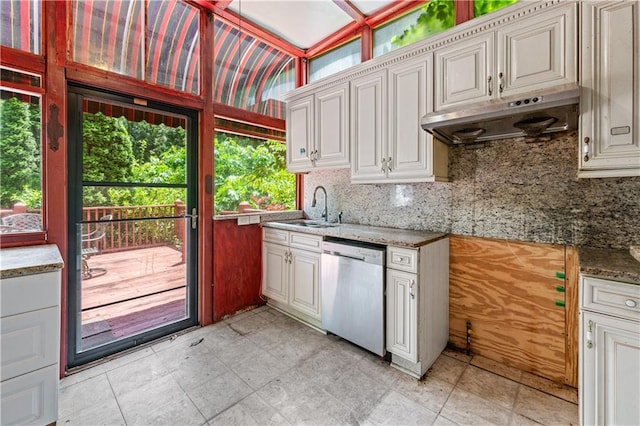 11569 Finley St, Suwanee, GA 30024 - kitchen featuring dishwasher, under cabinet range hood, a sink, and decorative backsplash