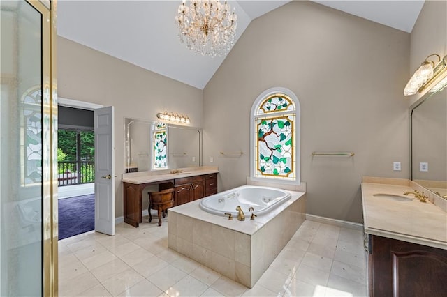 11569 Finley St, Suwanee, GA 30024 - bathroom featuring high vaulted ceiling, two vanities, a bath, tile patterned flooring, and a chandelier