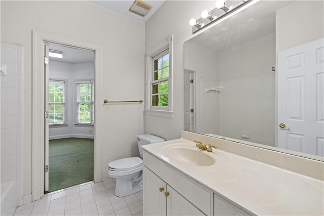 11569 Finley St, Suwanee, GA 30024 - bathroom with a shower, tile patterned flooring, toilet, and vanity
