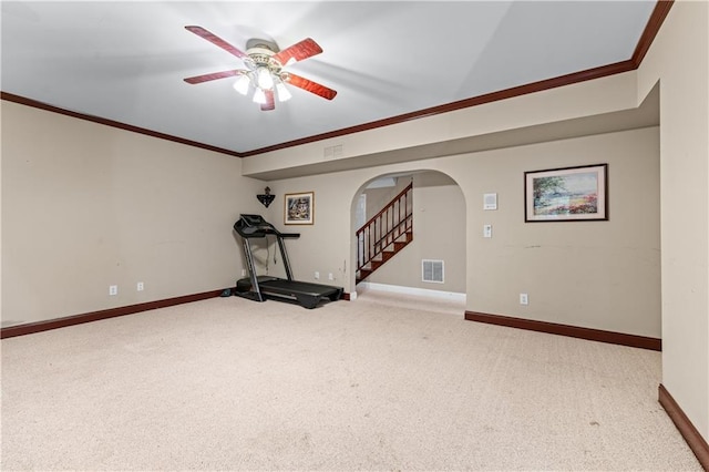 11569 Finley St, Suwanee, GA 30024 - exercise room featuring arched walkways, ornamental molding, a ceiling fan, carpet, and baseboards