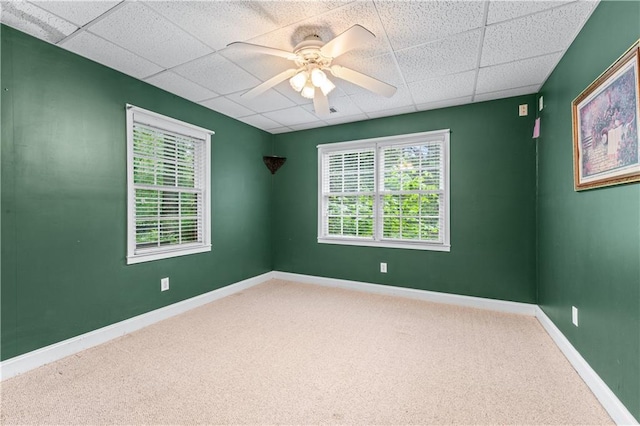 11569 Finley St, Suwanee, GA 30024 - carpeted empty room featuring a paneled ceiling, ceiling fan, and baseboards