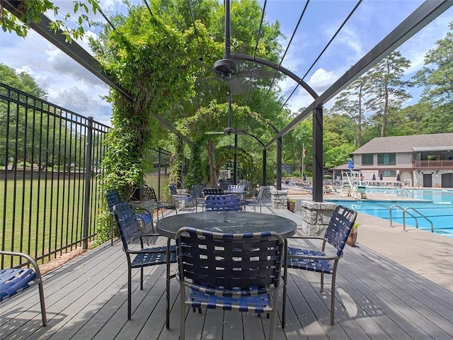 50 Rumson Way NE, Atlanta, GA 30305 - deck featuring a community pool, a lawn, fence, and outdoor dining area