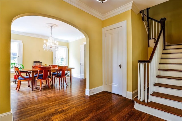 50 Rumson Way NE, Atlanta, GA 30305 - foyer with crown molding, wood finished floors, stairway, arched walkways, and a notable chandelier