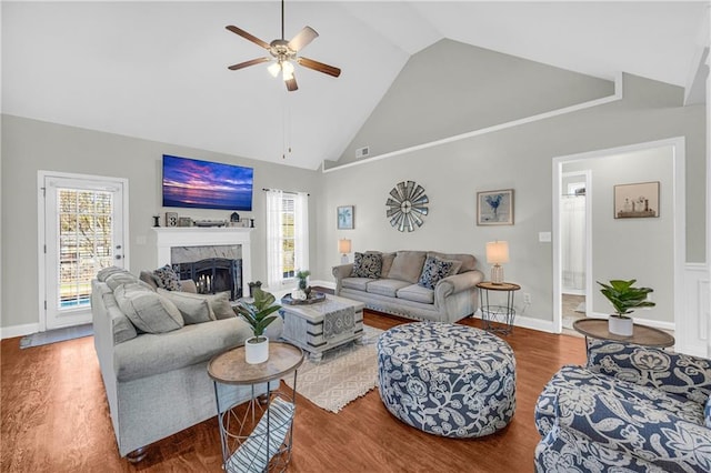 living room featuring wood finished floors, high vaulted ceiling, a healthy amount of sunlight, and ceiling fan