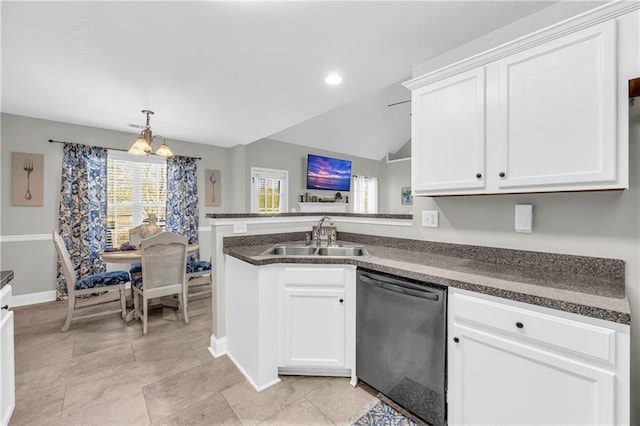 kitchen with a sink, dark countertops, dishwasher, and white cabinetry