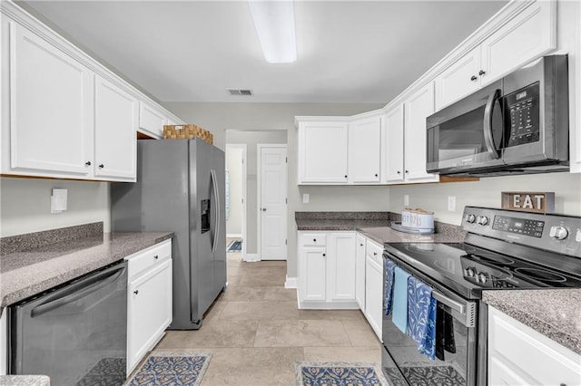 kitchen featuring white cabinetry, visible vents, and appliances with stainless steel finishes