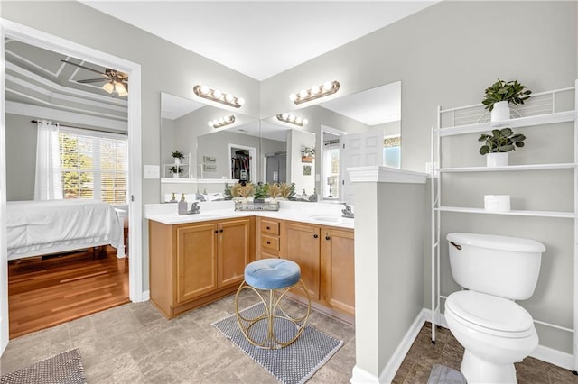 full bath featuring double vanity, ensuite bath, a ceiling fan, and a sink