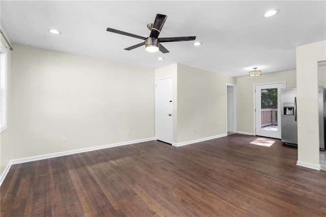 unfurnished living room featuring recessed lighting, dark wood finished floors, baseboards, and ceiling fan