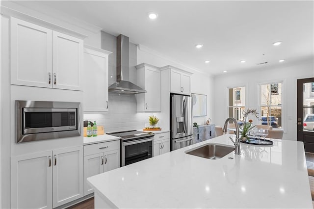 4918 Sudbrook Way Unit 252, Peachtree Corners, GA 30092 - kitchen featuring a sink, an island with sink, stainless steel appliances, light countertops, and wall chimney exhaust hood