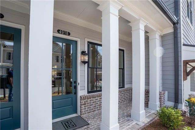 4918 Sudbrook Way Unit 252, Peachtree Corners, GA 30092 - view of exterior entry featuring brick siding and a porch