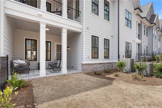 4918 Sudbrook Way Unit 252, Peachtree Corners, GA 30092 - view of exterior entry featuring fence, a porch, and cooling unit