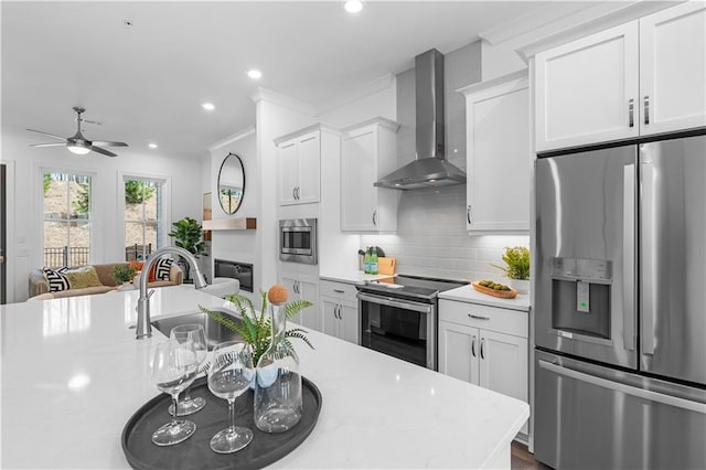 4918 Sudbrook Way Unit 252, Peachtree Corners, GA 30092 - kitchen with wall chimney range hood, tasteful backsplash, a sink, stainless steel appliances, and light countertops