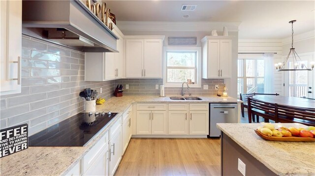 kitchen with premium range hood, a sink, visible vents, white cabinets, and dishwasher