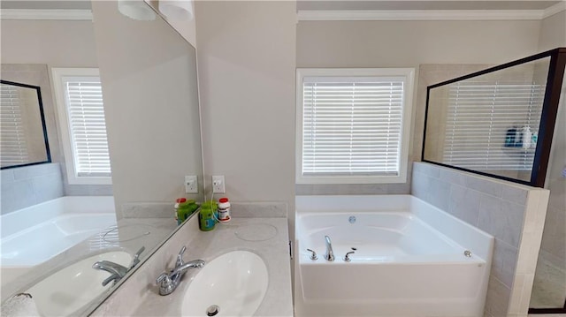 bathroom featuring ornamental molding, shower with separate bathtub, and vanity